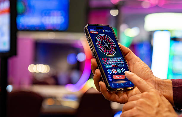 flagle Live Casino interface showing roulette wheel spin, bet slip, chat, and balance display